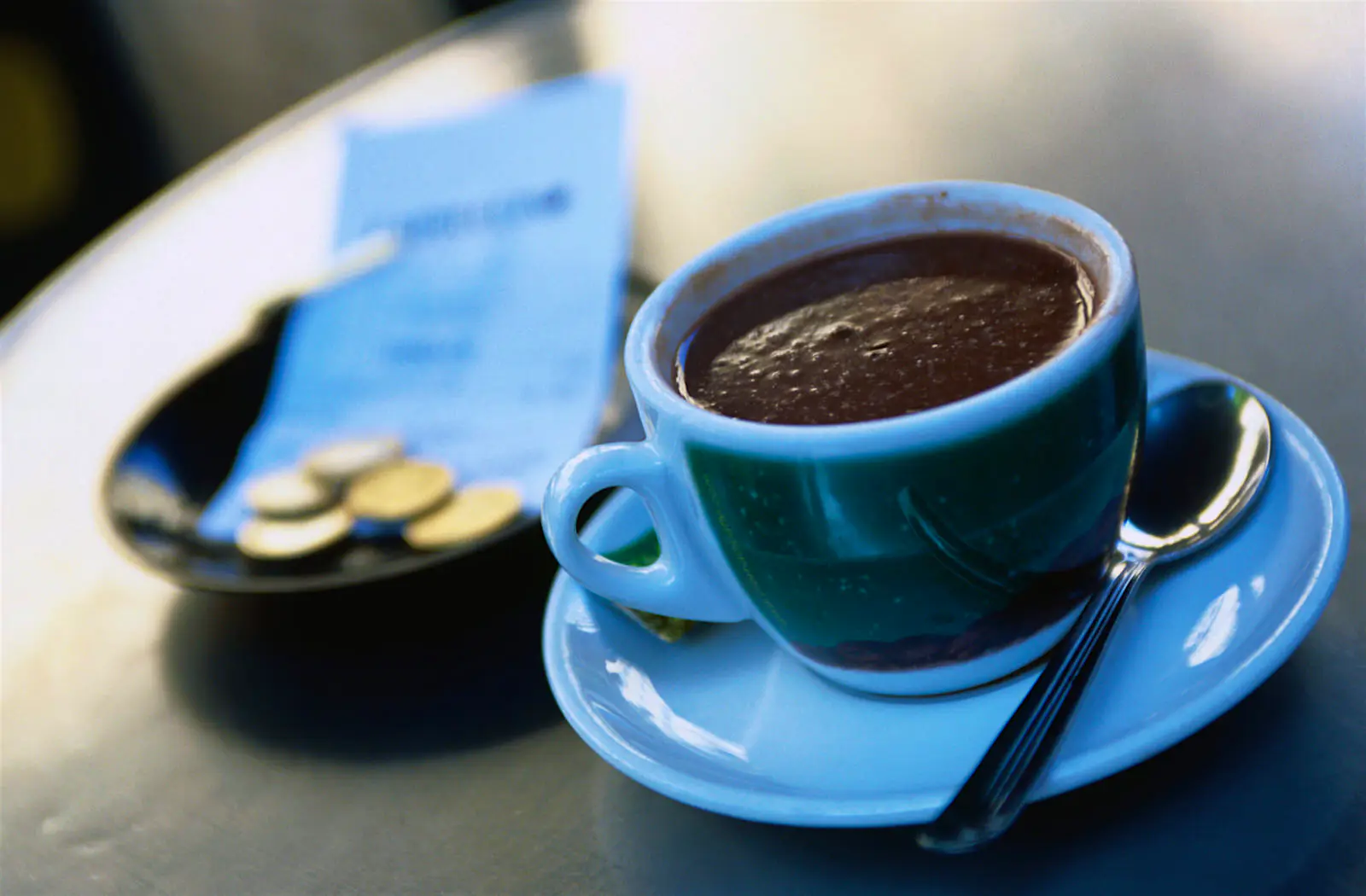 Features - 20308-60 Hot chocolate on a cafe table in Spain
