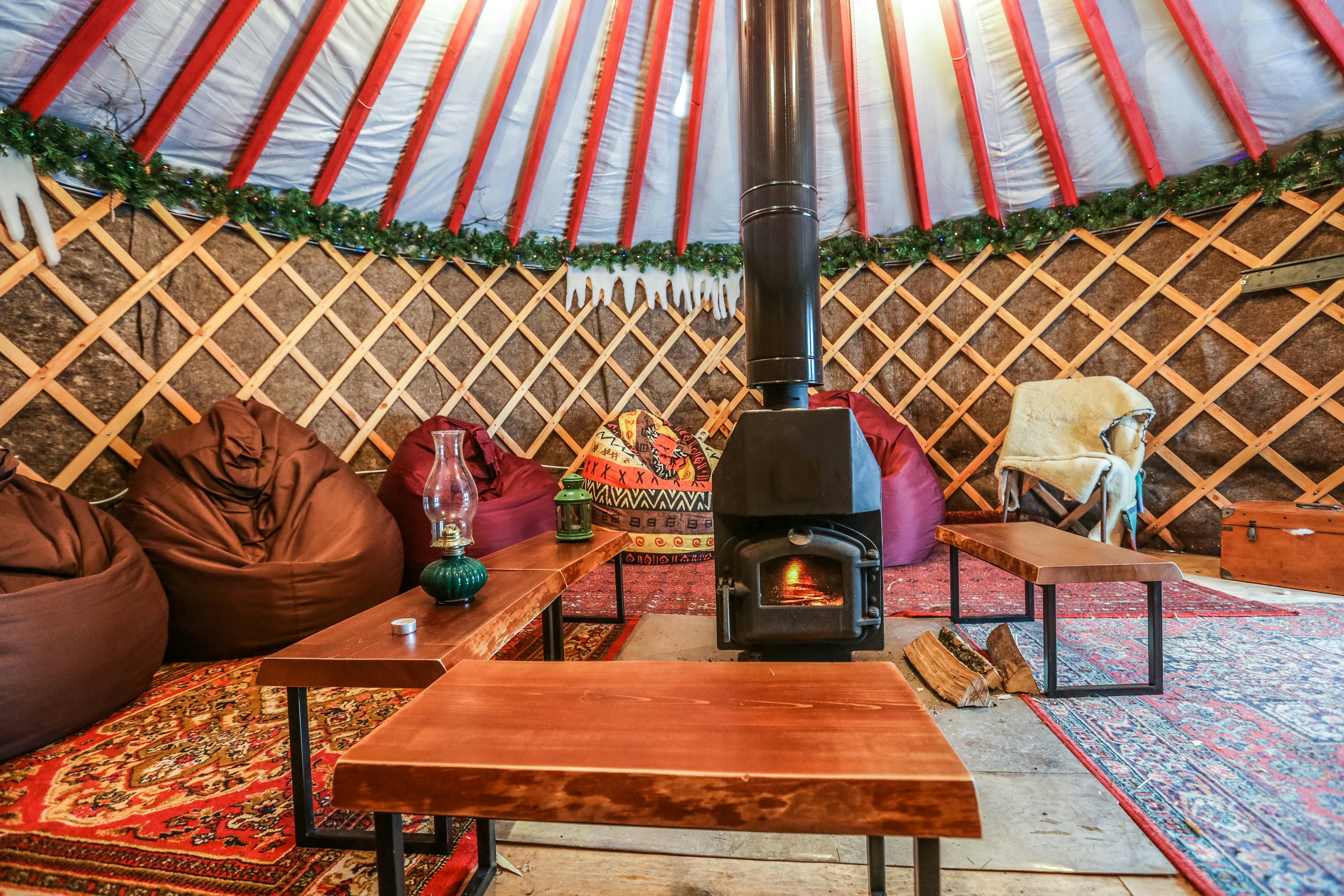 Cozy yurt camping interior with a fireplace