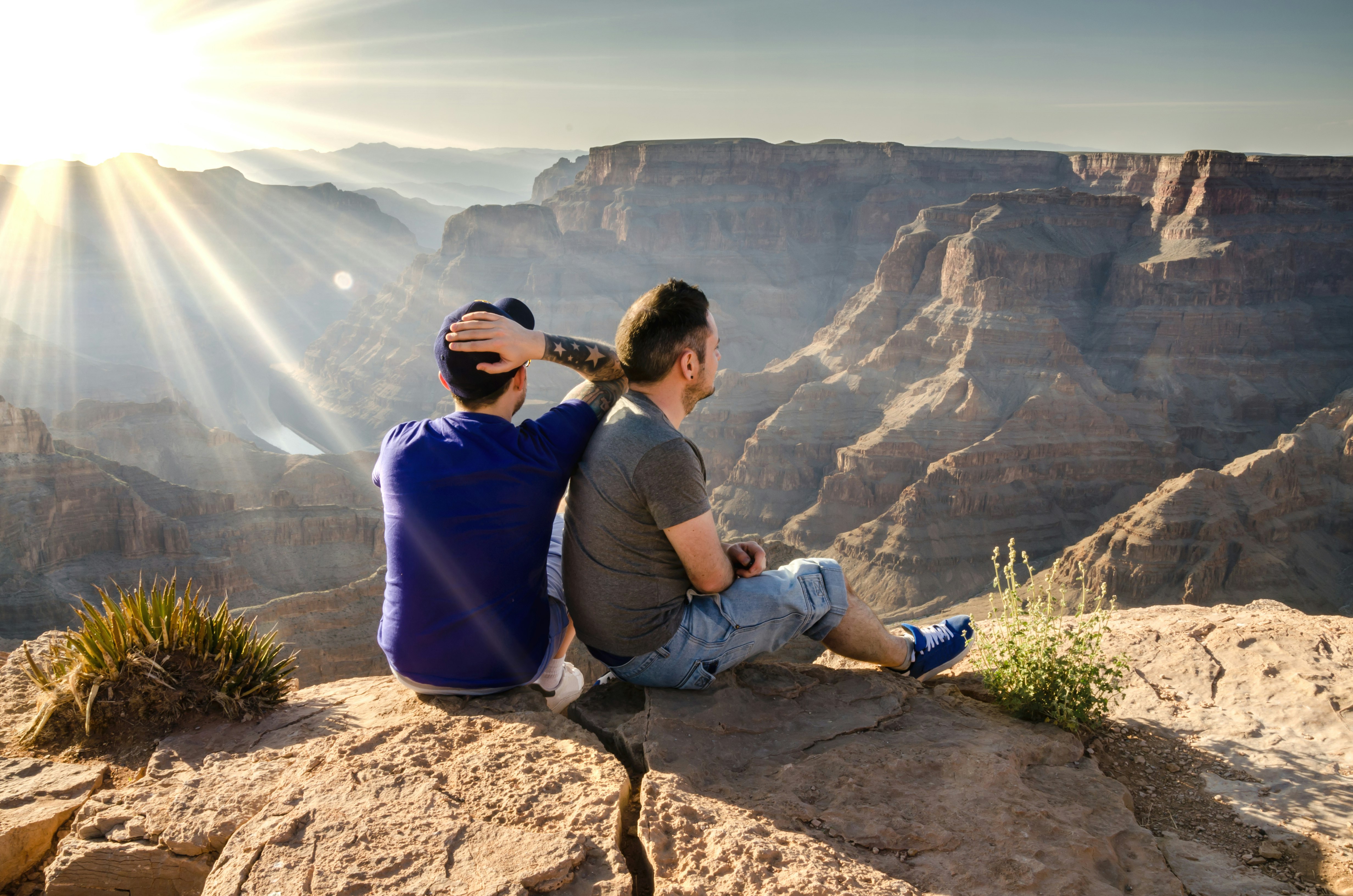 A young male couple looking into the Grand Canyon in Arizona, USA.