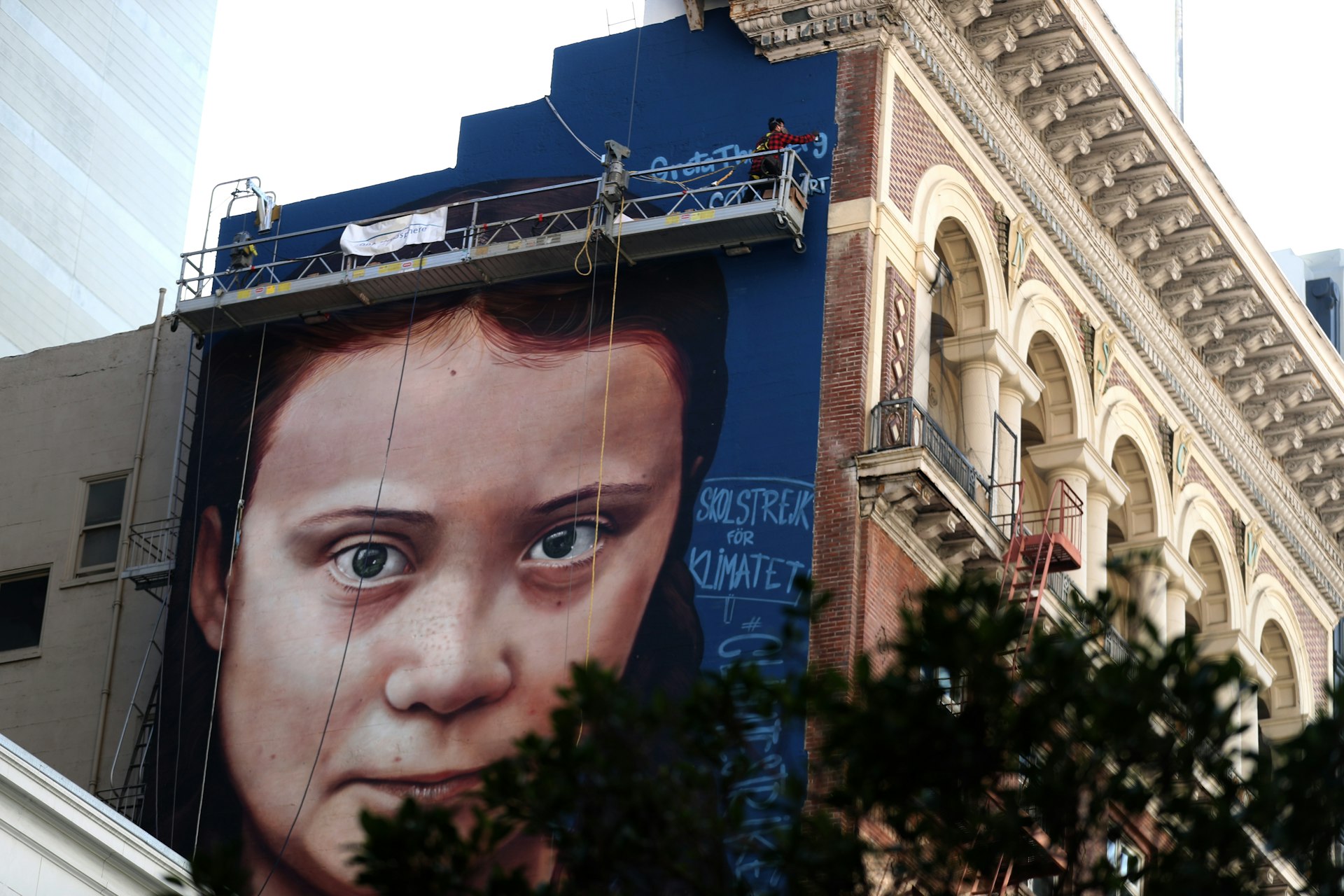 A picture of the mural, with a zoomed in Greta Thunberg