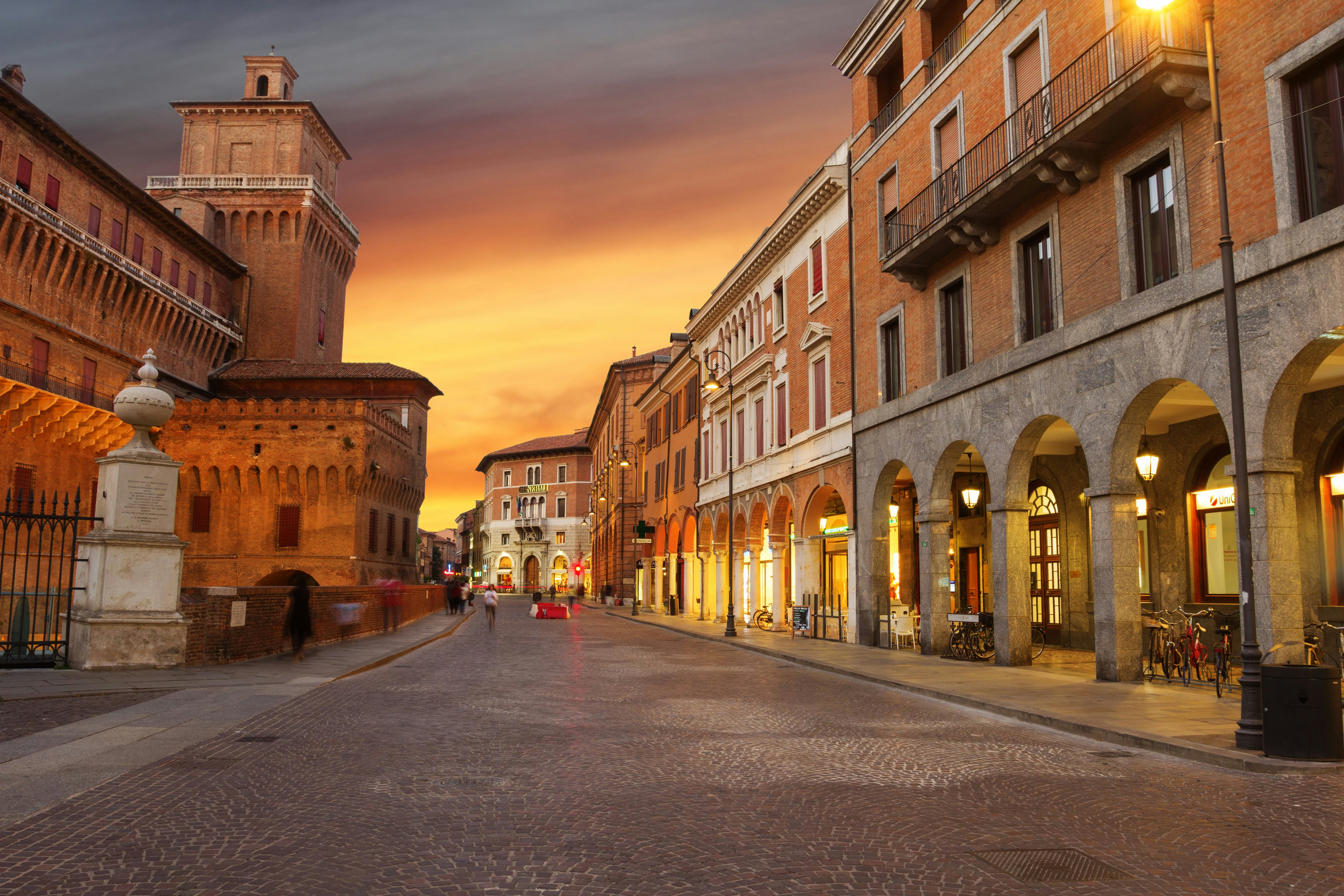 A street in Ferrara, Italy as sunset