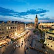 People strolling through Kraków’s Main Market Square in the evening © Capture / Getty Images