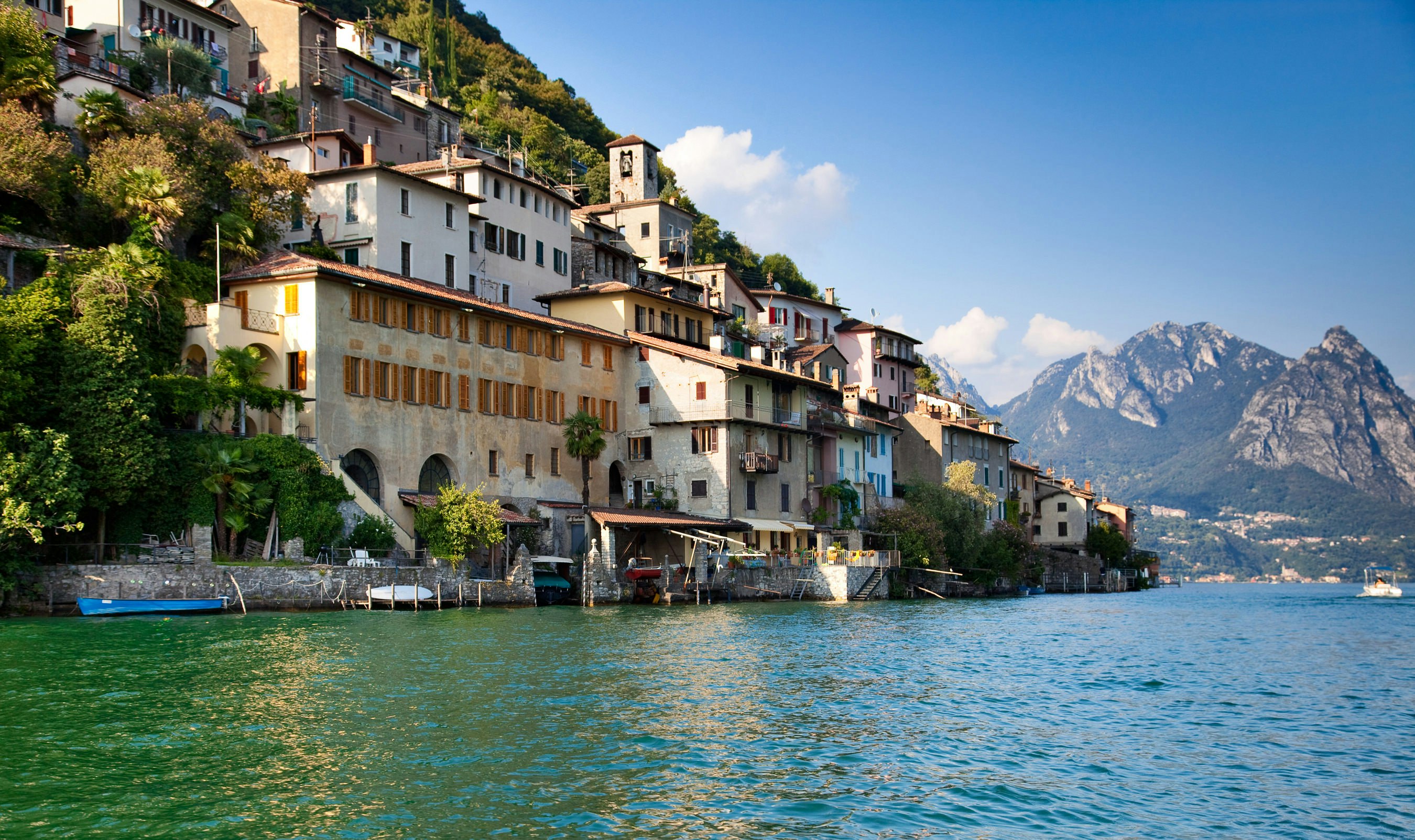 A picture of Lake Lugano and a picturesque town on its shores