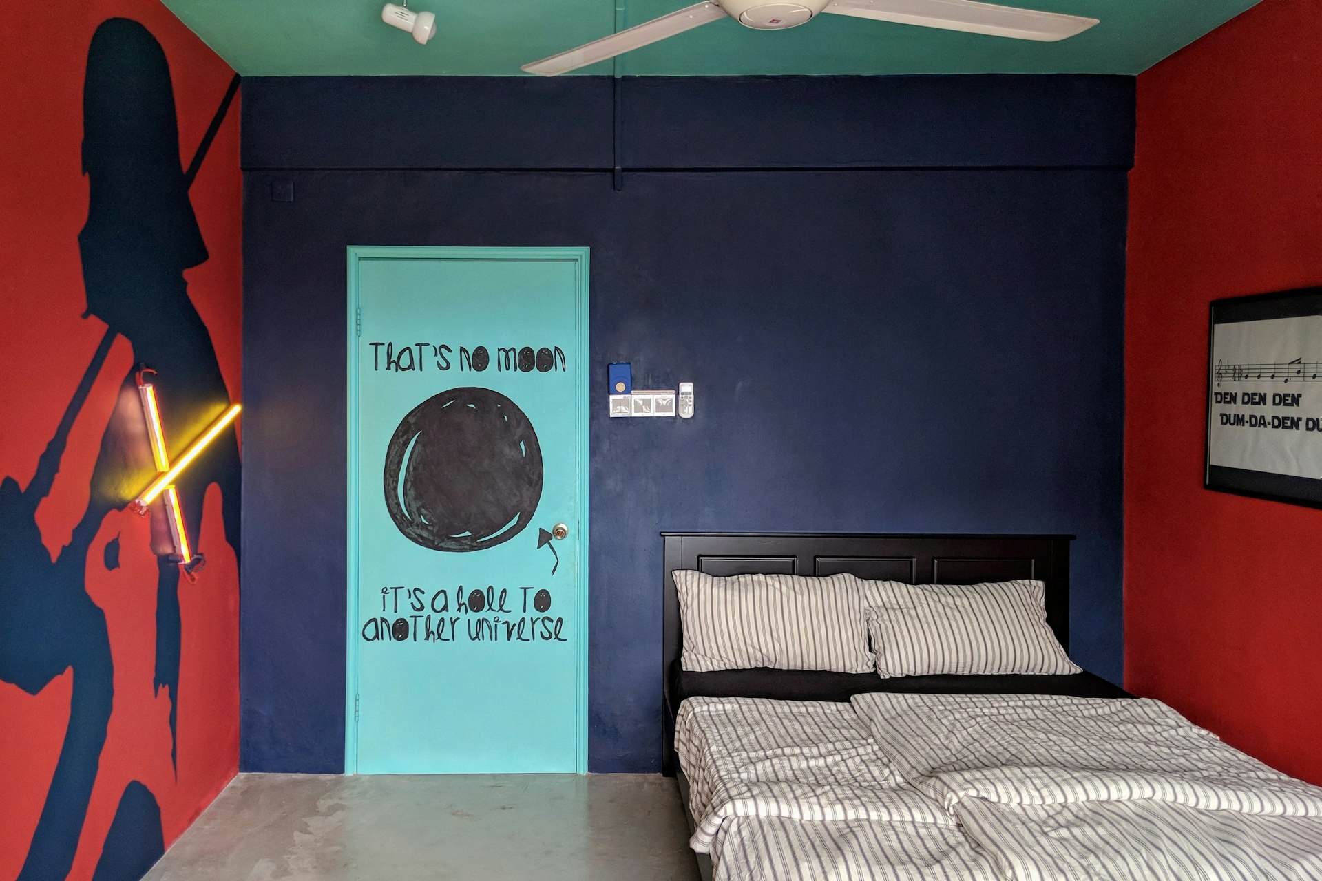 A picture of the bedroom in Kuala Lumpur with extensive Star Wars wall decorations