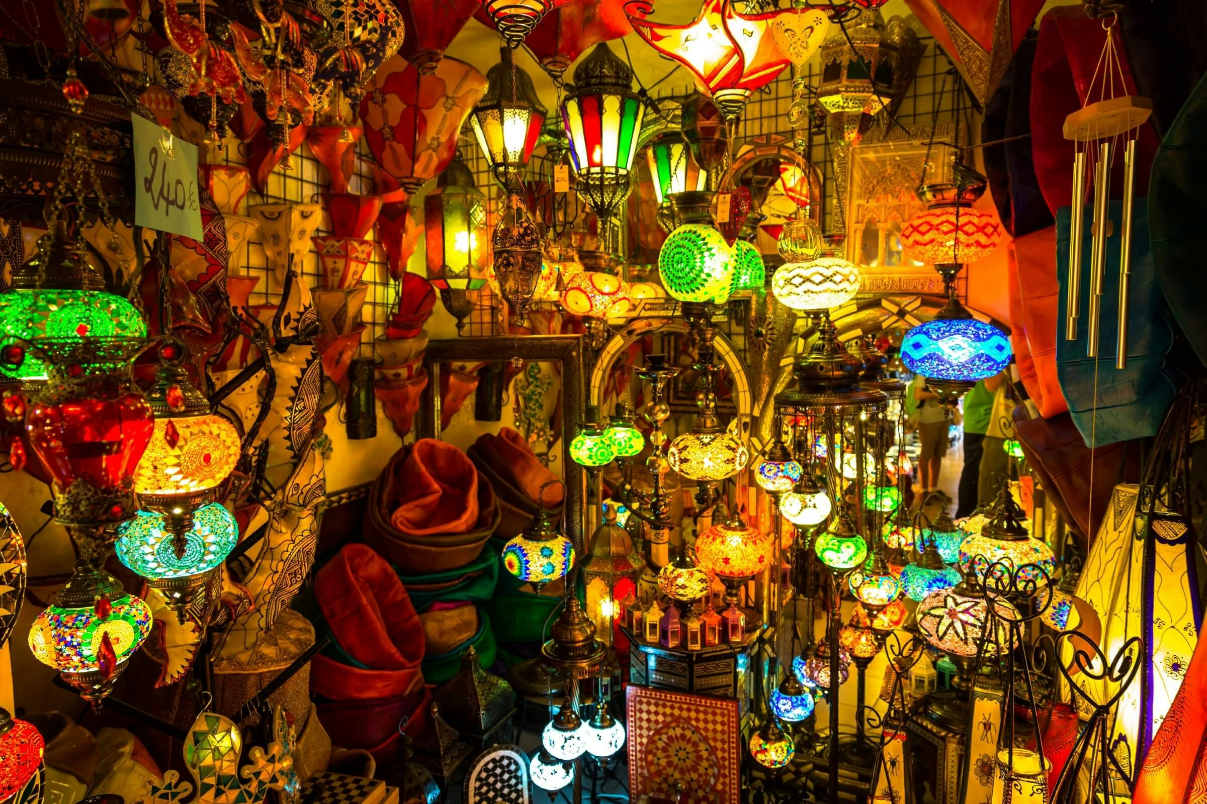 Dozens of colourful lamps glowing in a stall