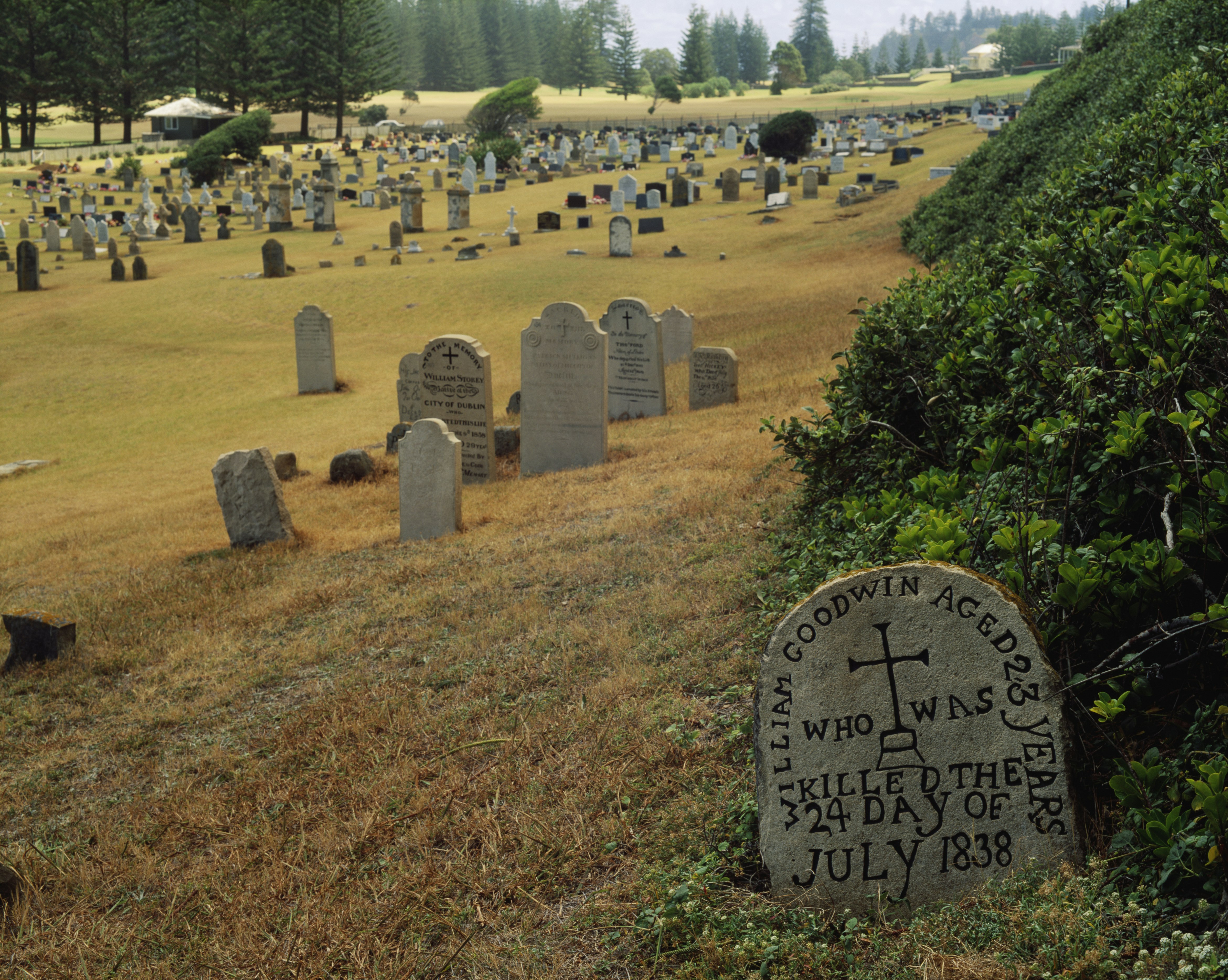 A cemetery in the former penal colony on Norfolk Island shows carved headstones from the 1800s 