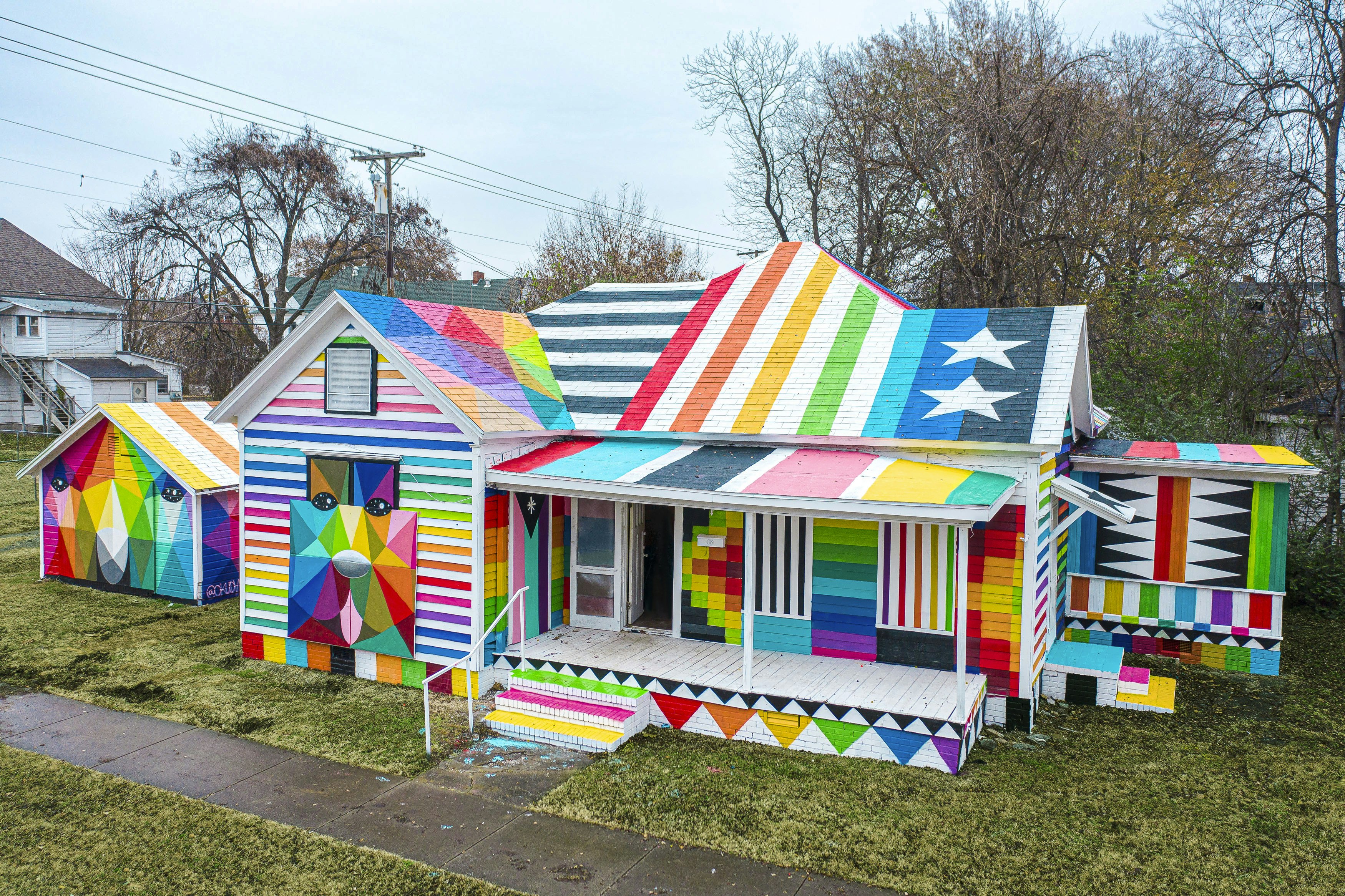 An overview of the Rainbow Embassy, an old residential house completely covered in bright colours
