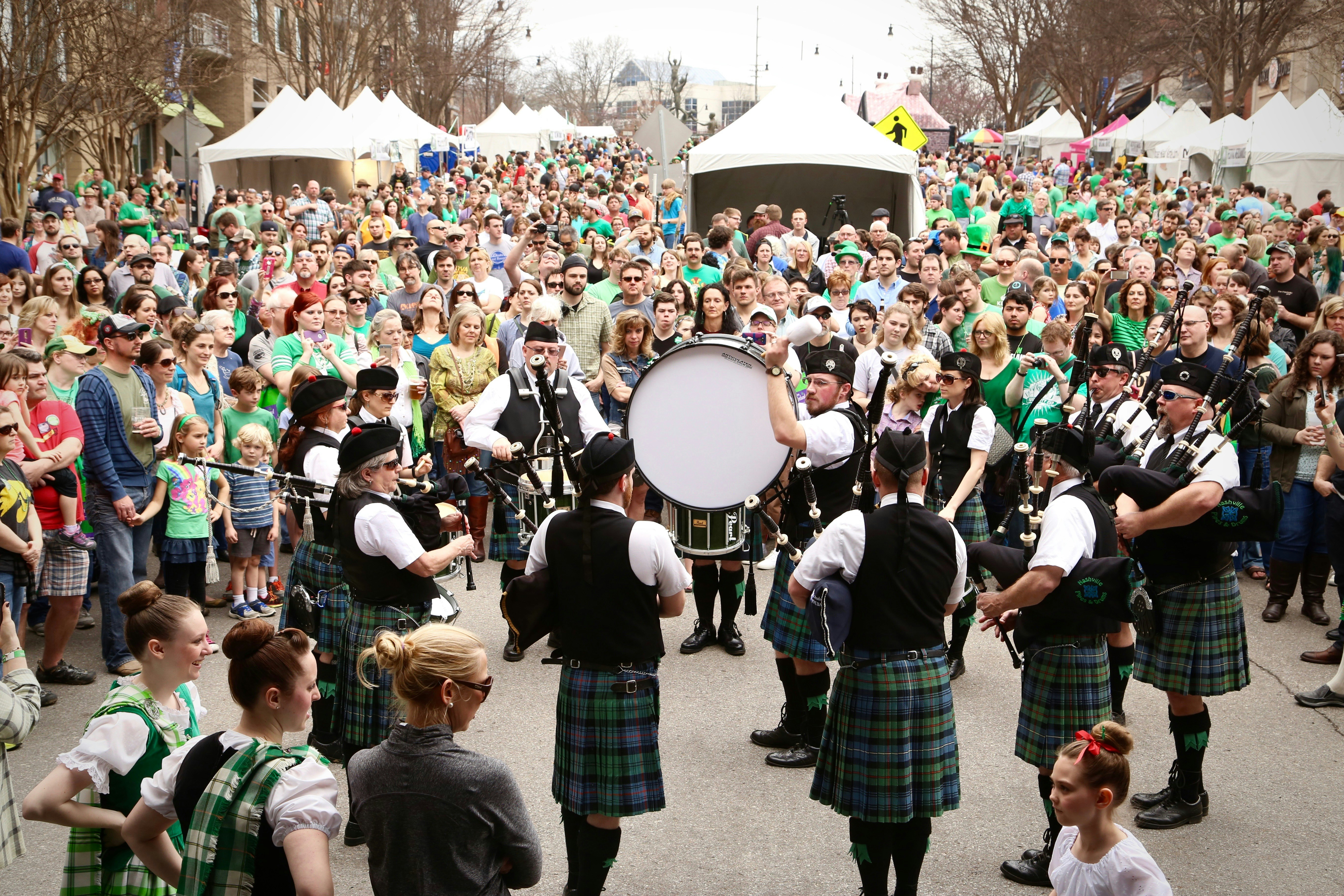 A pipe band puts on a street performance