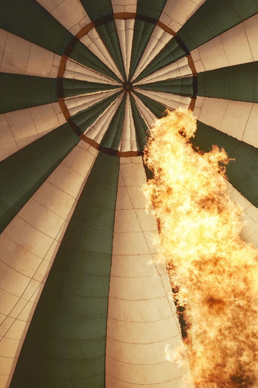A rising inferno of flame is seen within the inside of the hot-air balloon.