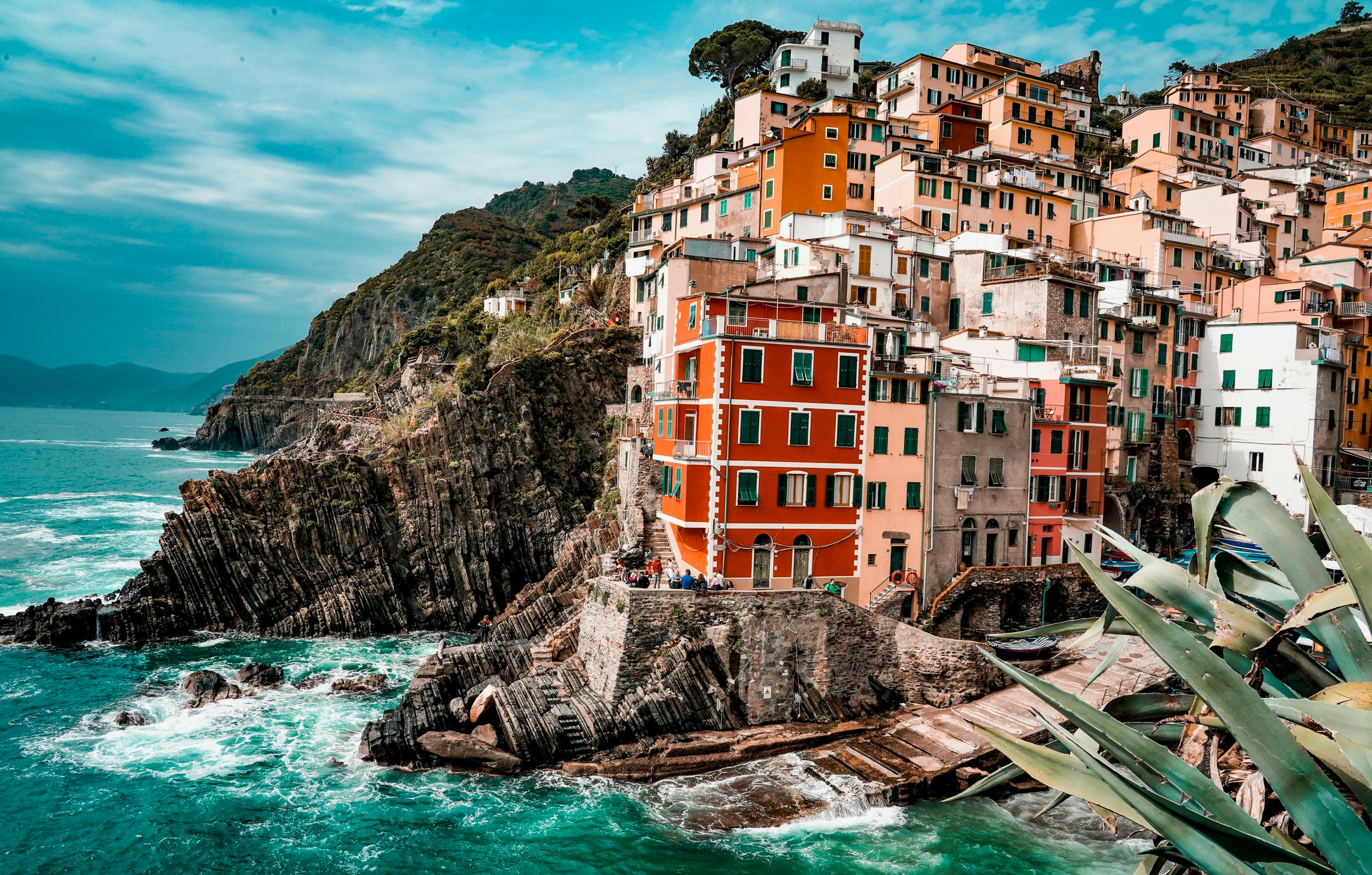 A beautiful shot of the town of Riomaggiore, with its coloured houses and rugged shoreline