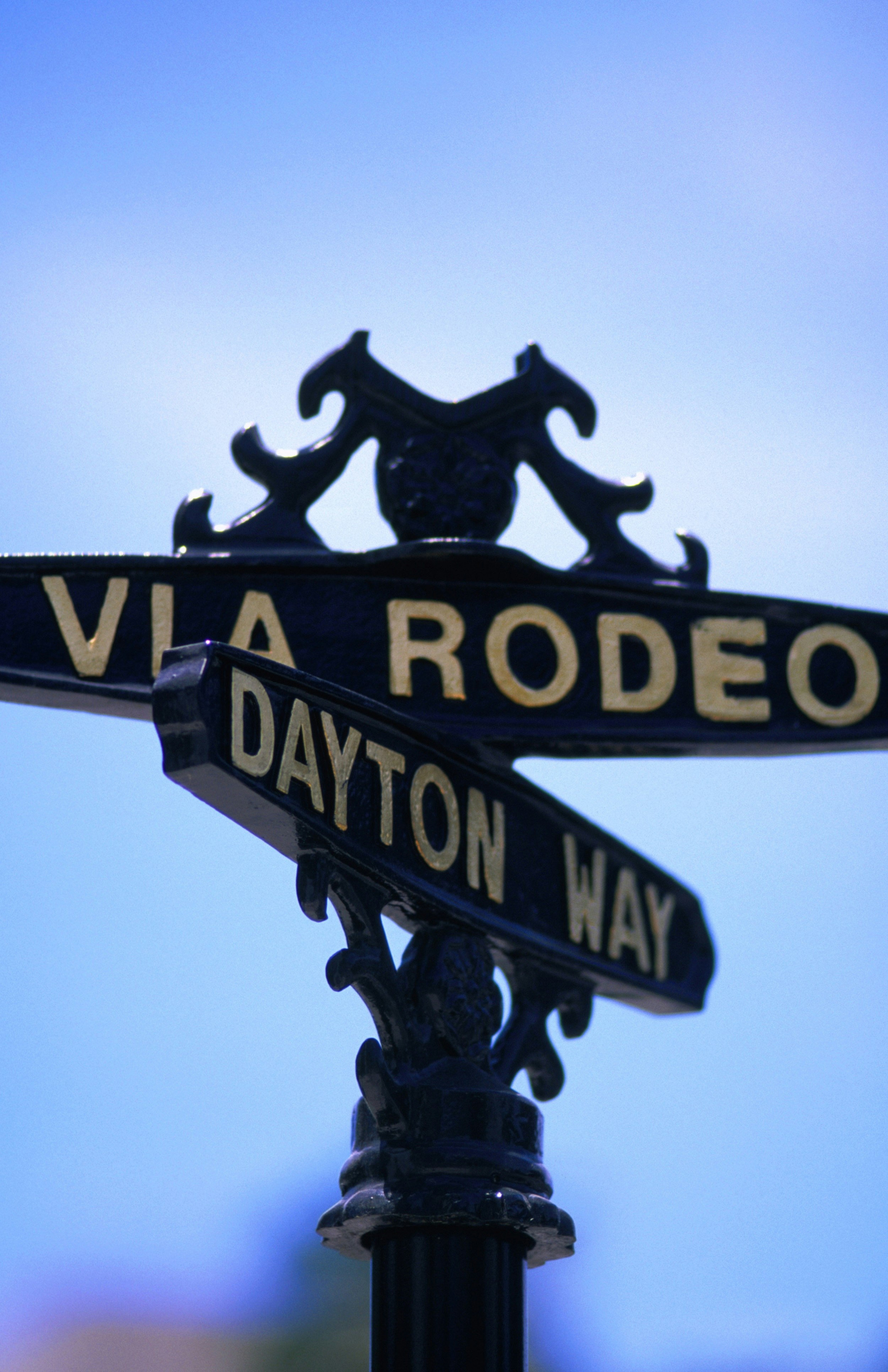 Ornamental bronze street signs for the intersection of Rodeo Drive and Dayton Way.