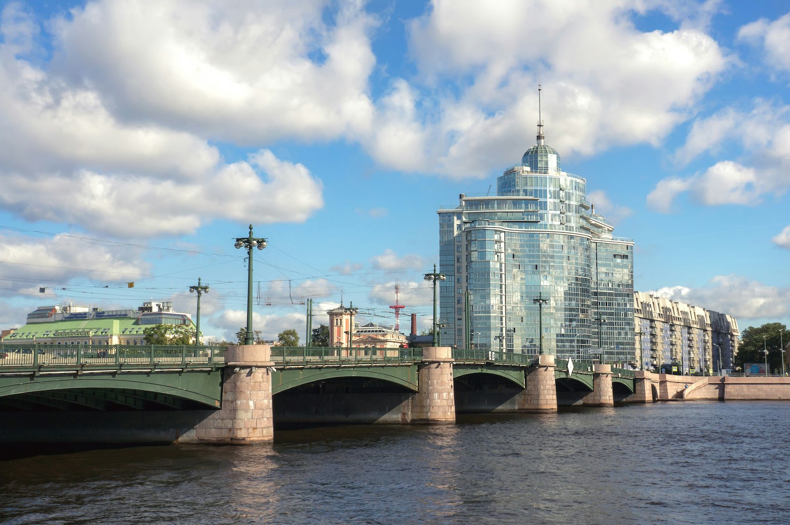 View of Sampsonievsky bridge. Modern glass building on background. Cityscape urban view.
