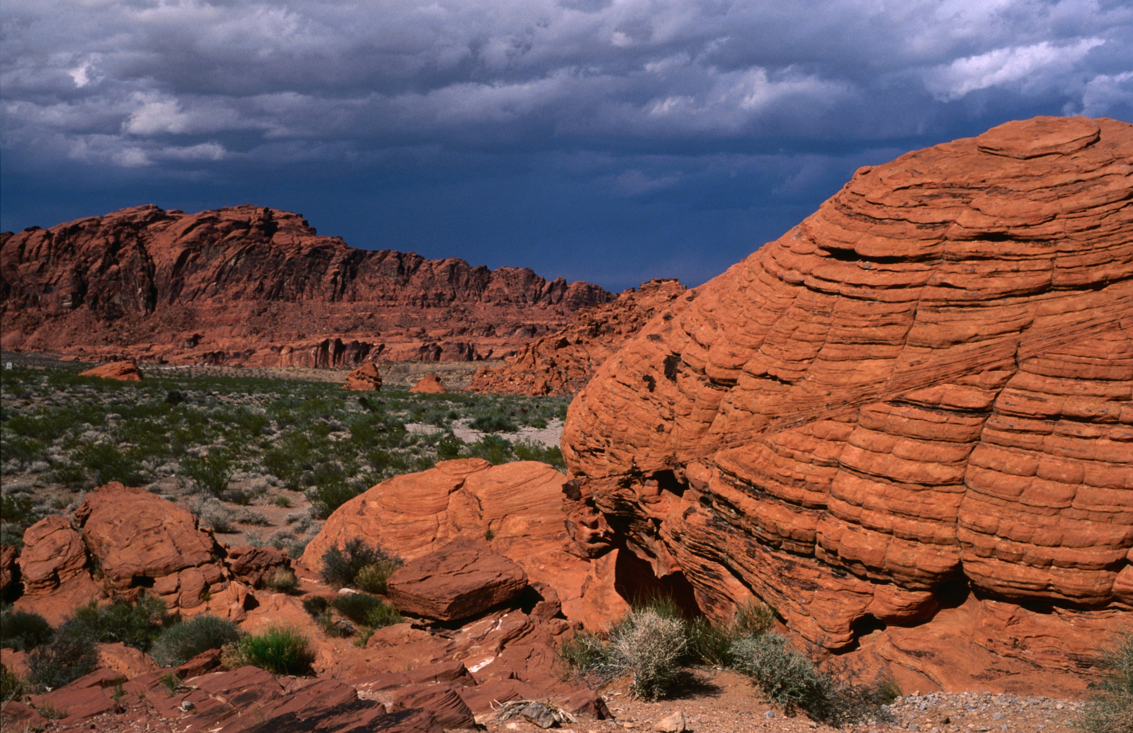 Red sandstone rock formations eroded into dome shapes