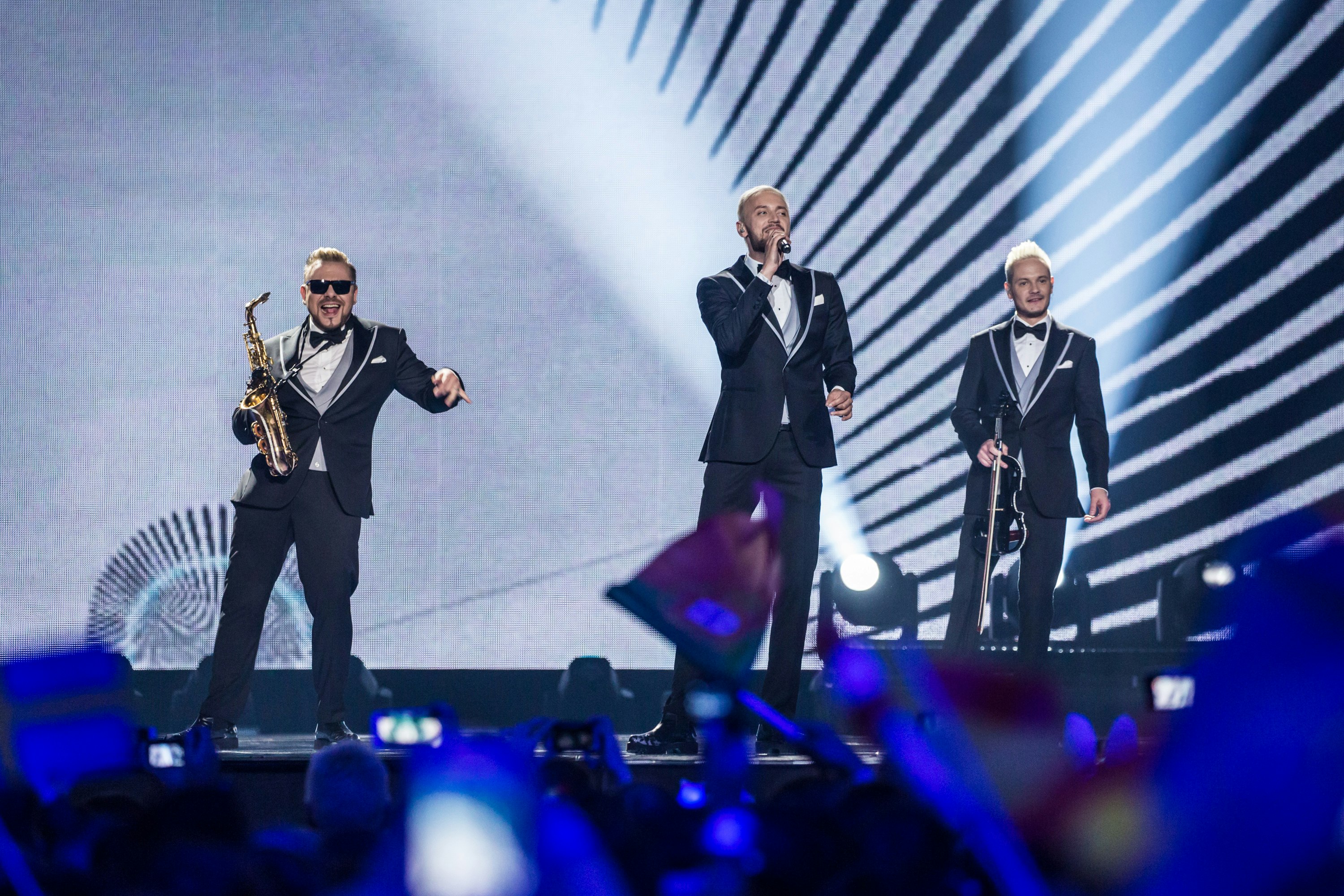 A picture of the three members of Sunstroke Project on stage during the 2017 Eurovision