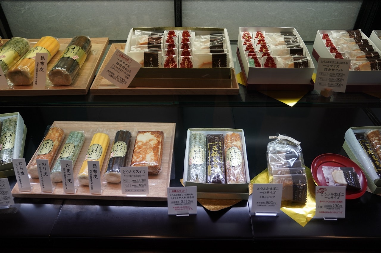An array of sweets are laid out for sale in a glass case