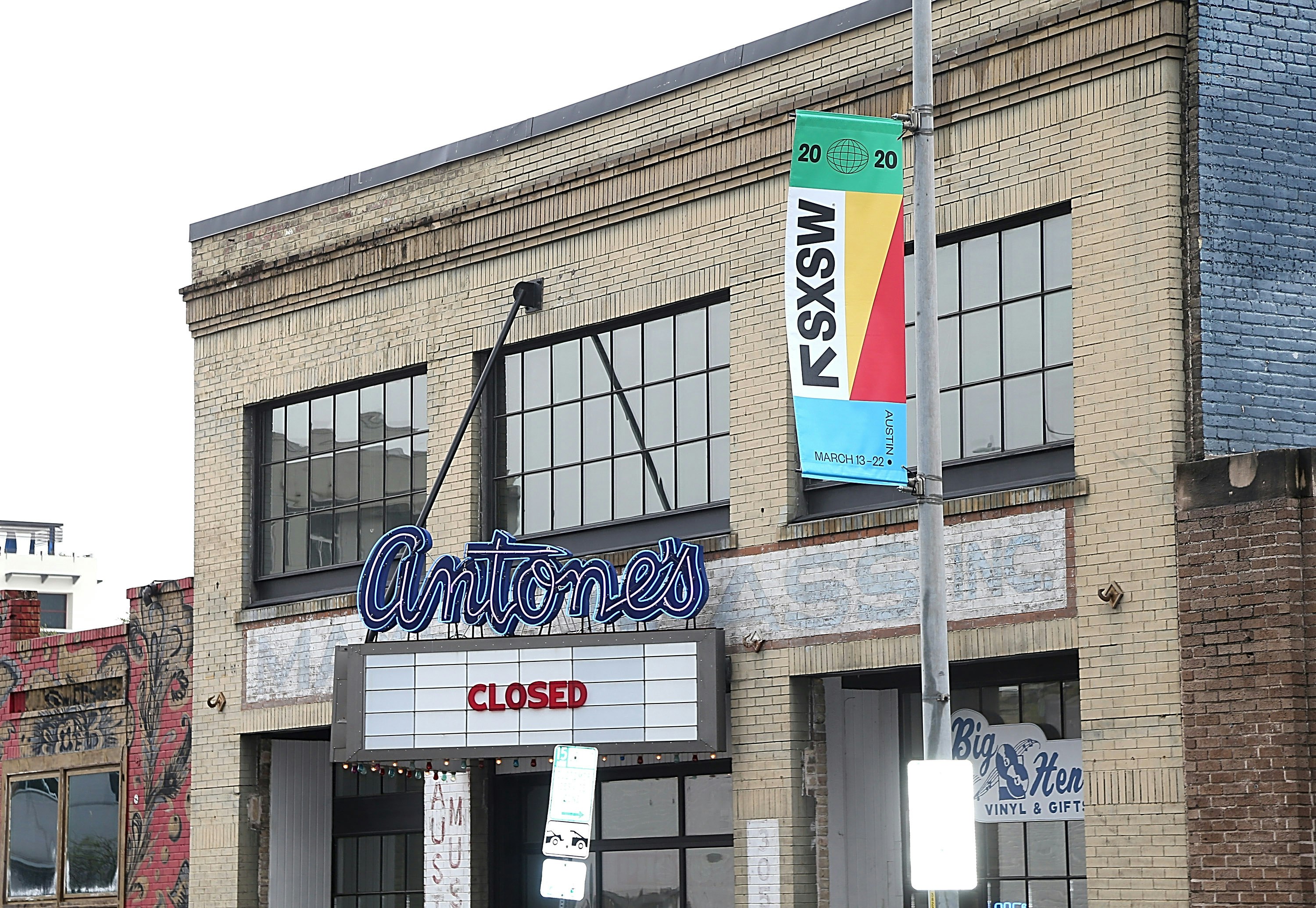 A cinema with a sign reading "closed" next to a banner for the SXSW festival