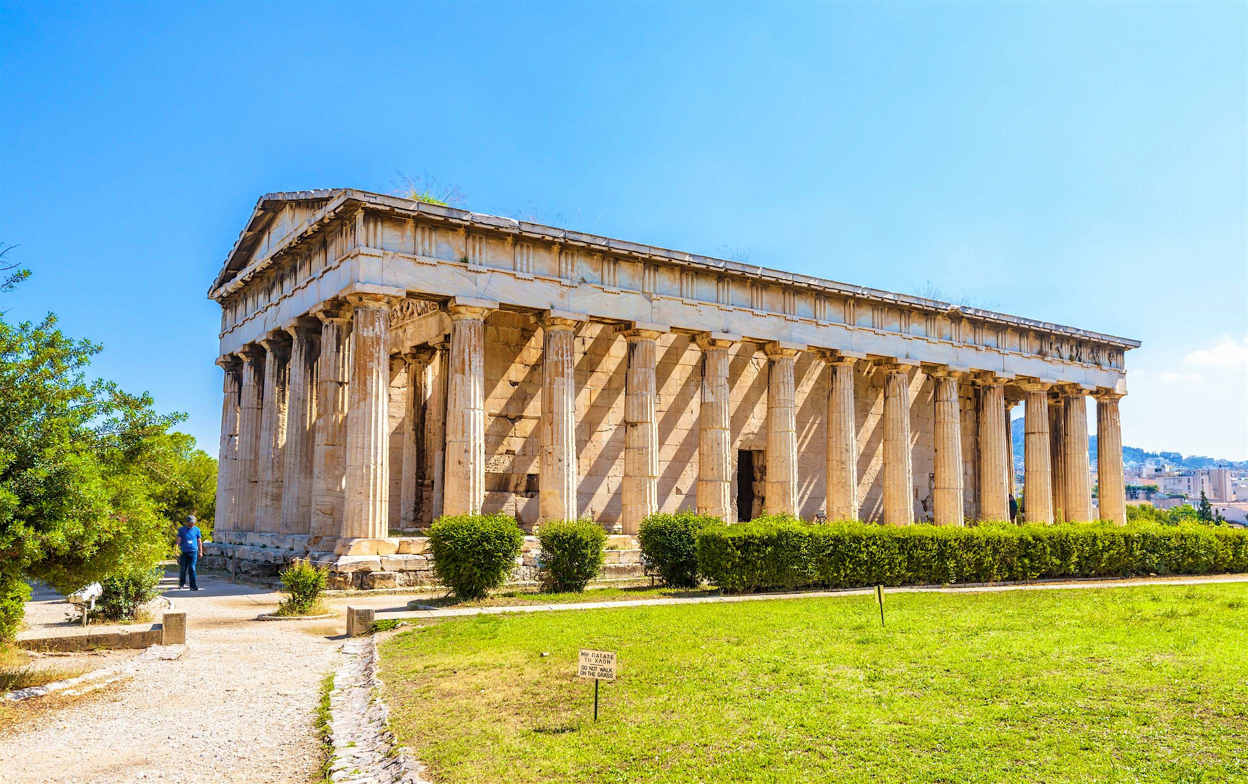 Hephaestus Temple, part of Ancient Agora A large temple building with many columns stands in well-kept but simple gardens