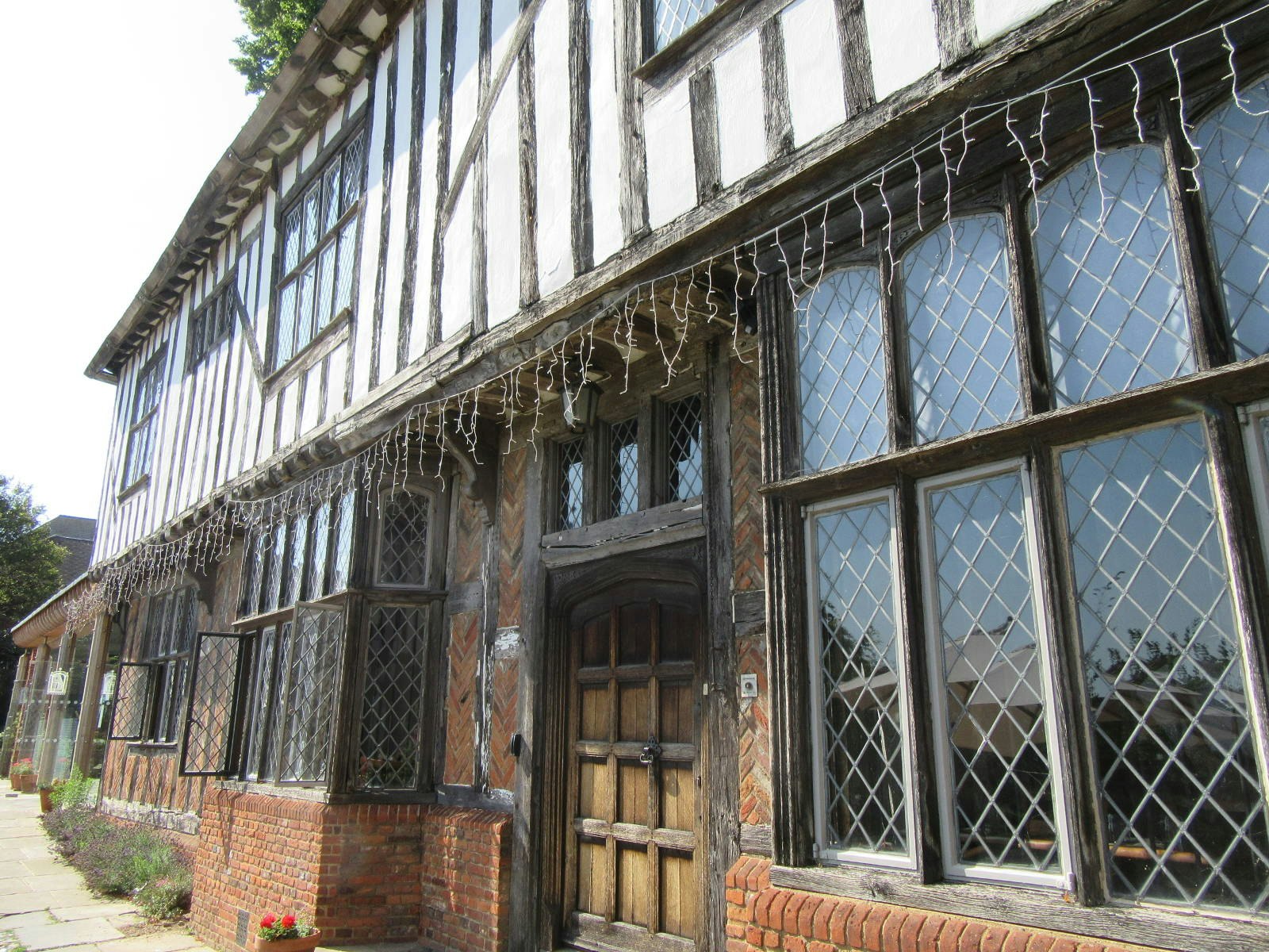A close up of the black and white Tudor facade.