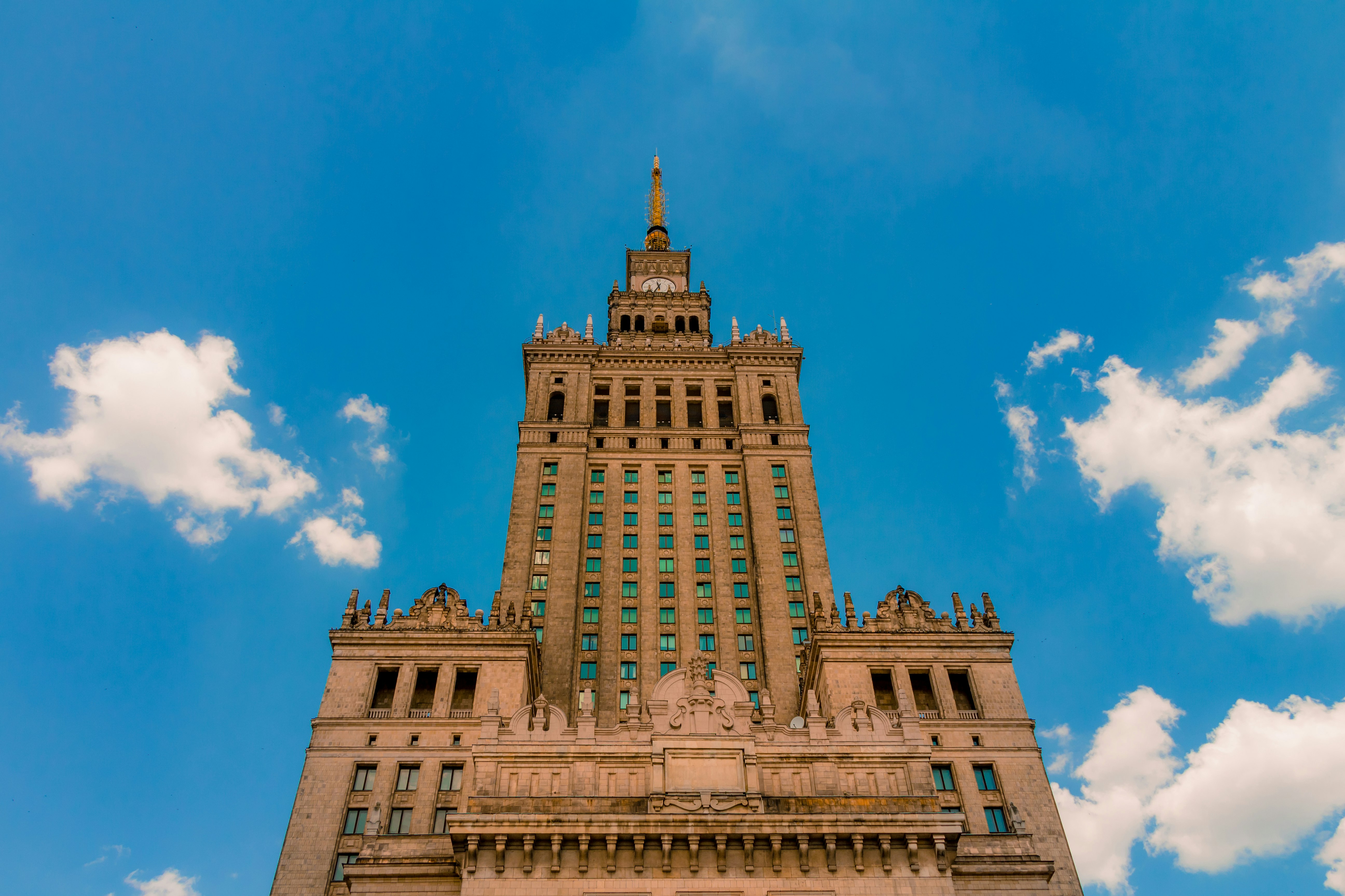A low-angle view of a large Gothic building in Warsaw. 