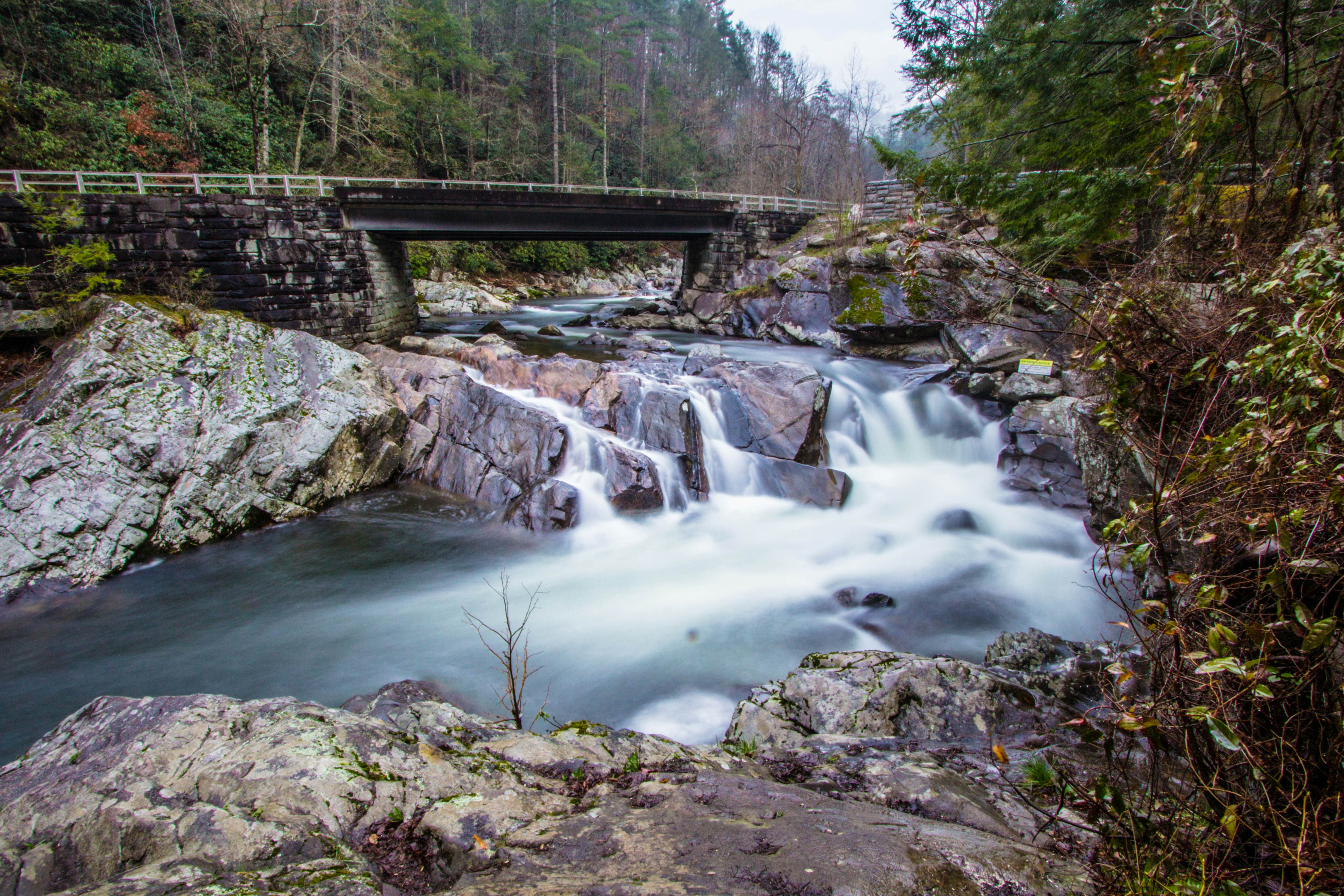 A long exposure of water rushing over rocks