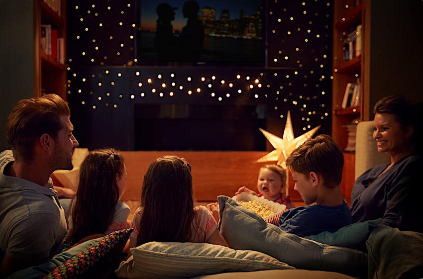 Kids Blog - shutterstock_750823318 A family gather on cushions to watch a film © Monkey Business Images / Shutterstock