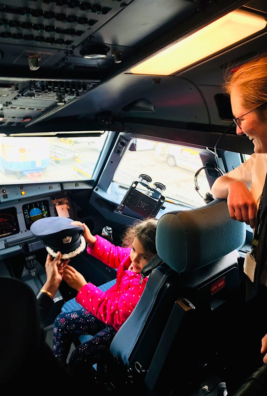 Kids Blog - peter2 A child sits in the cockpit of a passenger plane