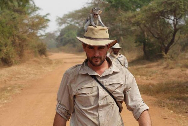 A little monkey hitches a ride with Levison Wood as he walks the Nile.  
