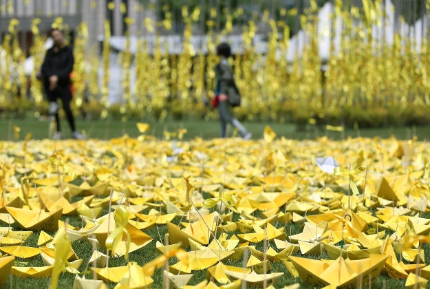 Paper boats line the Seoul plaza as a tribute to those who their lives in the Sewol Ferry tragedy.  