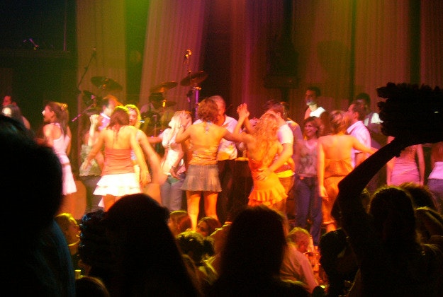 A live band entertains the crowd at a bouzoukia club.