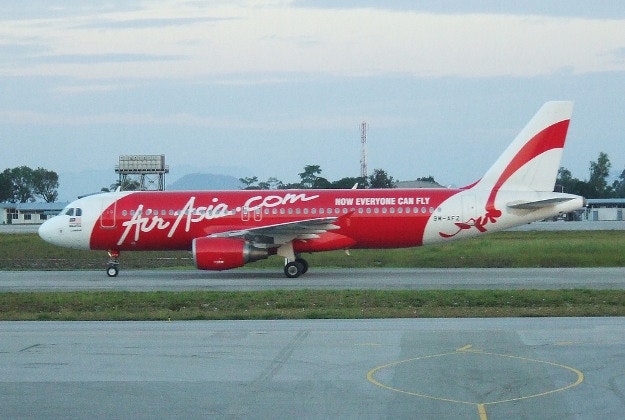 Air Asia flight forced to turn back after passenger disturbance.