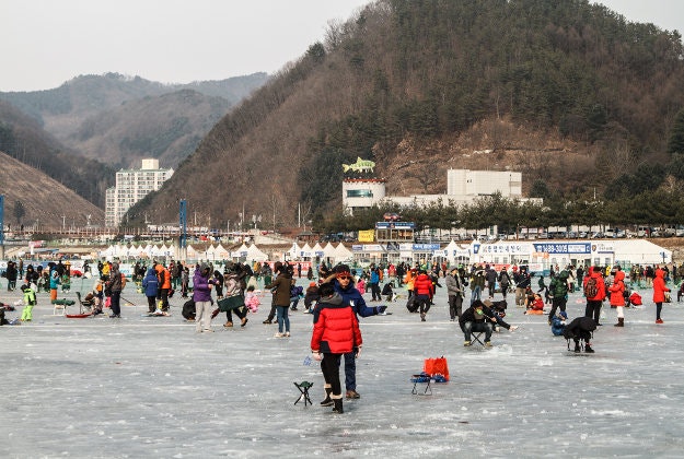 Crowds gather on the ice for the Hwacheon Sancheoneo Ice Festival.