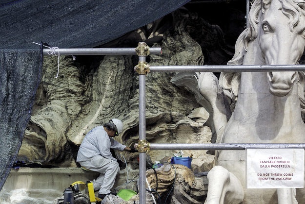 Restoration works being carried out on the Trevi fountain in September 2014.