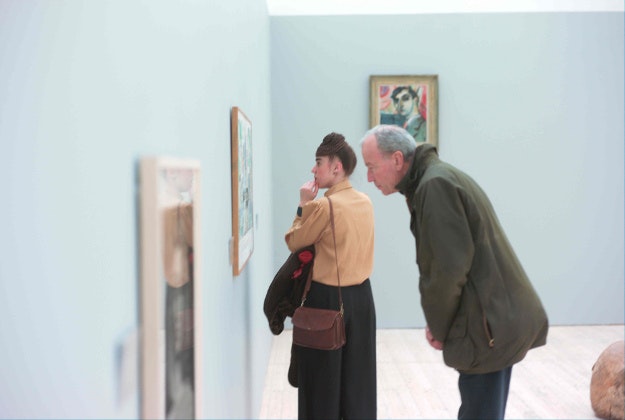 Visitors browse an exhibition at the Malmö Konsthall.