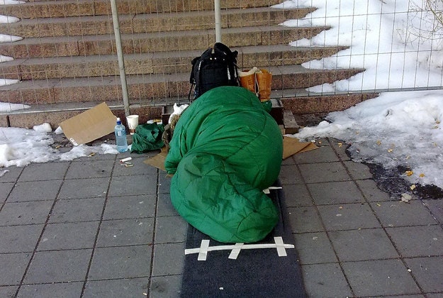 A homeless person sleeps rough on the streets of Oslo, Norway.