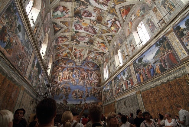 Visitors admire the Sistine Chapel.