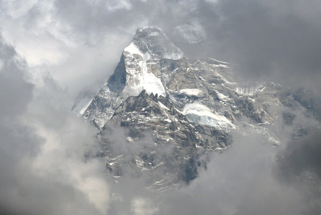 The summit of Mount Everest engulfed in clouds.