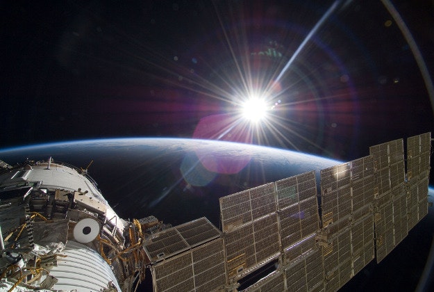 The sun rises over the horizon seen from the International Space Station.