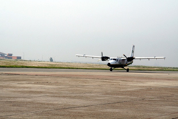A small plane lands at Kathmandu airport.