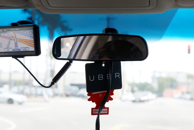 Taxi with an Uber device inside