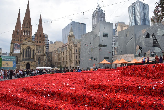 Federation Square lined with poppies in commemoration of ANZAC Day.