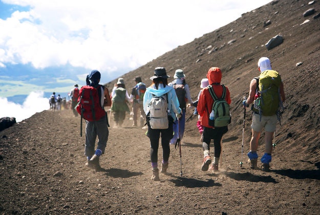 Hikers climbing up Mt Fuji.