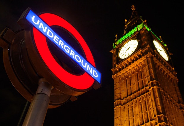 The London underground sign against the night sky as talks aimed at agreeing pay and conditions for workers on the new all-night Tube service in London are to be held today. 