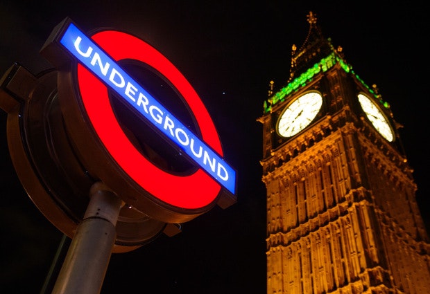 The London underground sign against the night sky as talks aimed at agreeing pay and conditions for workers on the new all-night Tube service in London are to be held today.