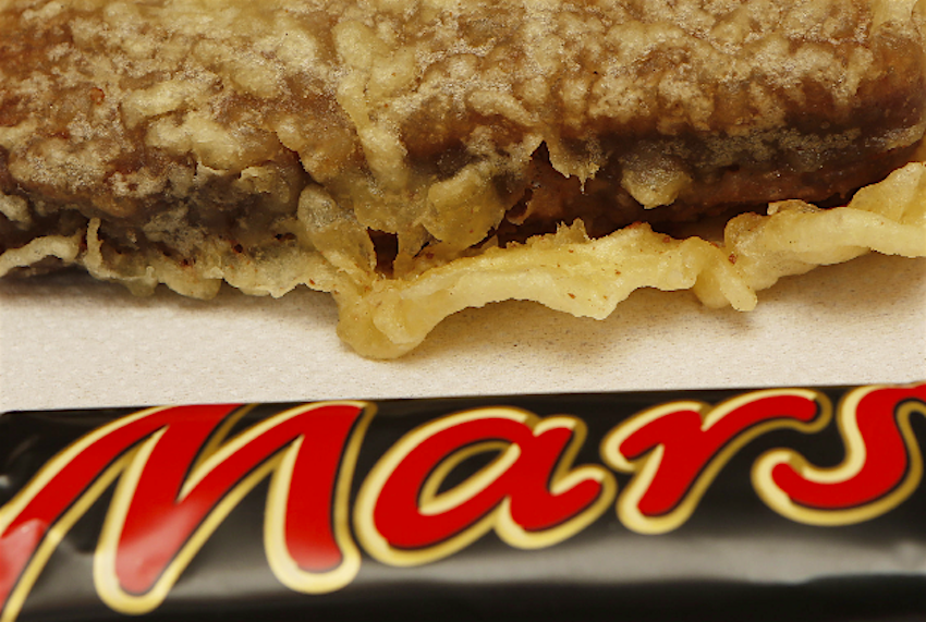 Travel News - deepfriedmarsbar A chip shop has been asked to remove a banner hailing it as the home of the deep-fried Mars bar.