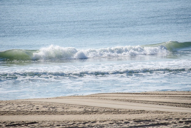 Surf along Ocean City beach, Maryland.