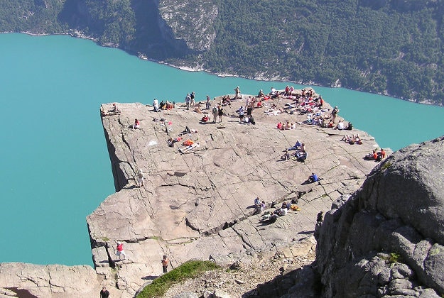 Tourists enjoying the views from Norway's Pulpit Rock.