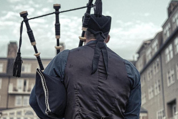 Bagpiper drowns out hate speech.