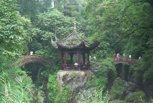 Tourists crossing a footbridge on the slopes of Emei Shan.