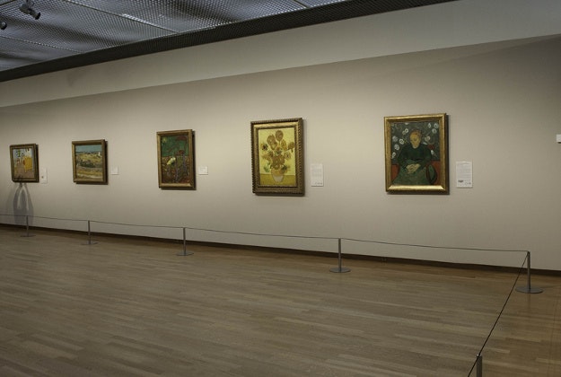 Van Gogh museum with sunflowers painting featured centre.