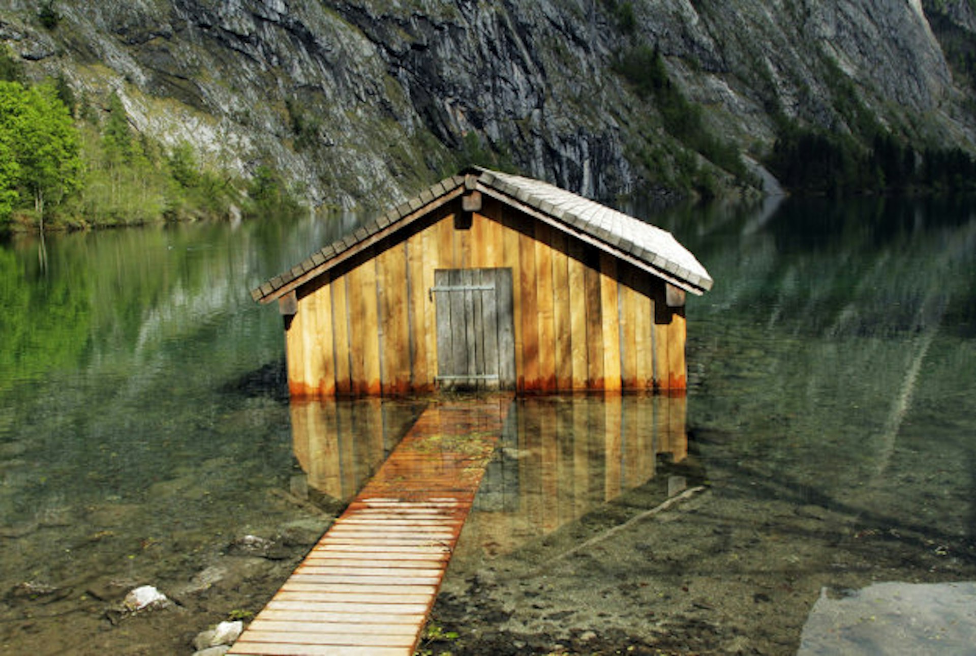 A boathouse on the Obersee, a lake in Bavaria, Germany